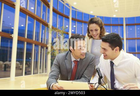 Executives with digital tablet, video conference. Stock Photo