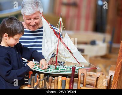 Grandfather and grandson, Building model sailboat, Whaleship, Pasaia, Gipuzkoa, Basque Country, Spain, Europe. Stock Photo