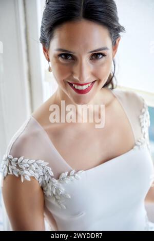 Bride trying on wedding dress in atelier of clothing designer, Bilbao, Spain. Stock Photo