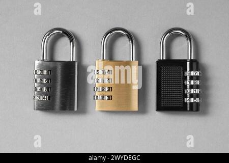 Steel combination padlocks on grey background, top view Stock Photo