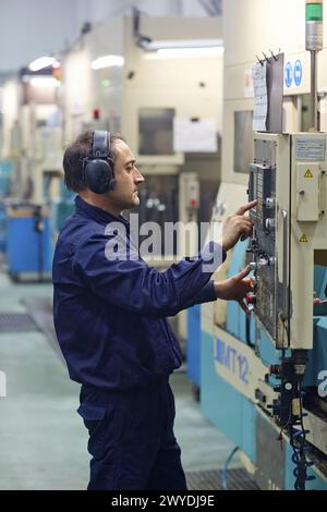 Technician CNC control. Area automated CNC lathes. Machined Indecober. Machining of precision parts in series. Automotive industry. Berriz. Bizkaia. Basque Country. Spain. Stock Photo