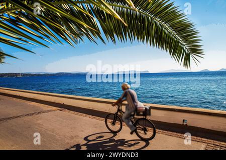 Blurred motion person  on Spetses road  with amazing garden  - one of the best Greek islands  in Mediterranean Sea - fantastic recreation on Greek isl Stock Photo