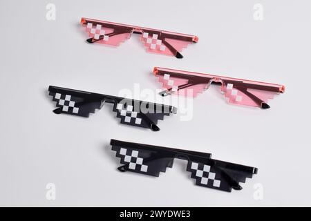 Thug life glasses black and pink color isolated on white background. Pixel art glasses Stock Photo