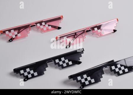 Thug life glasses black and pink color isolated on white background. Pixel art glasses Stock Photo