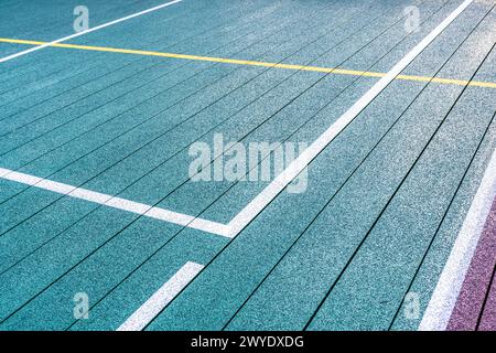 Elevated Platform Tennis, Paddle Ball courts with yellow pickelball lines.  Floor surface is green with white and yellow Stock Photo