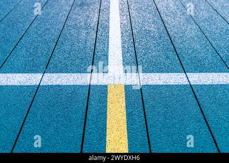 Elevated Platform Tennis, Paddle Ball courts with yellow pickelball lines.  Floor surface is green with white and yellow Stock Photo