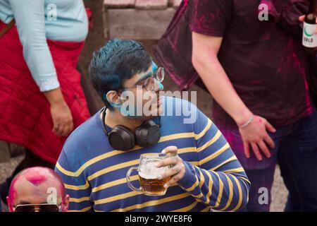 Berlin, Germany, March 30, 2024. Hundreds of people celebrate Holi Festival, a sacred Hindu holiday. Stock Photo