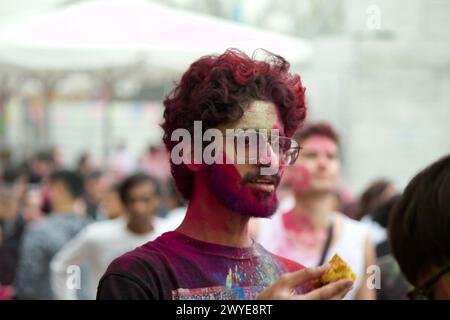 Berlin, Germany, March 30, 2024. Hundreds of people celebrate Holi Festival, a sacred Hindu holiday. Stock Photo