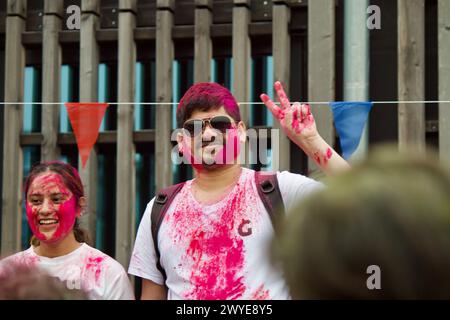 Berlin, Germany, March 30, 2024. Hundreds of people celebrate Holi Festival, a sacred Hindu holiday. Stock Photo