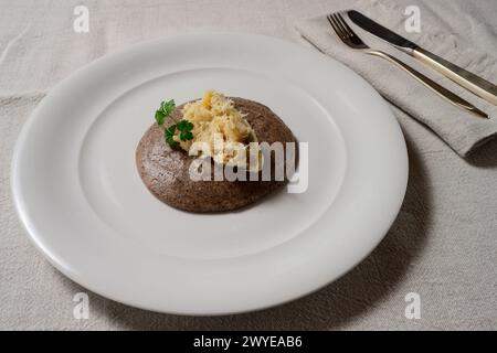 Baccala alla Vicentina with Black Polenta Nera Venitian Stockfish from Vicenza Stock Photo