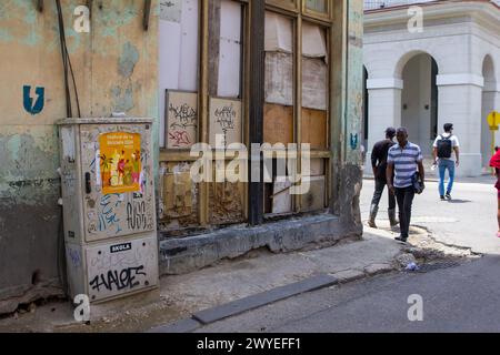 Dirty broken weathered building full of graffiti in Havana, Cuba Stock Photo