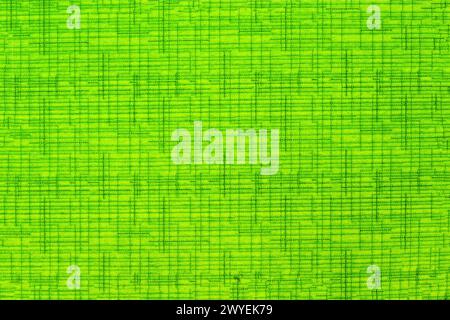 Texture of green roller blind material close-up. Photo of green artificial fabric. Stock Photo