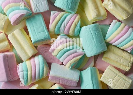 marshmallows close-up, colorful fluffy soft sugar confectionery different shapes and sizes, pile of candy snack pieces in full frame food background Stock Photo