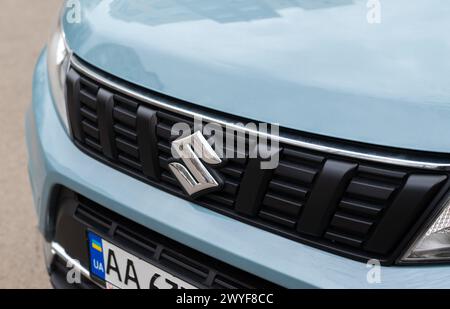 Kyiv, Ukraine. April 6, 2024. Close-up view of logo of Suzuki letter S on a new blue car radiator grille Stock Photo