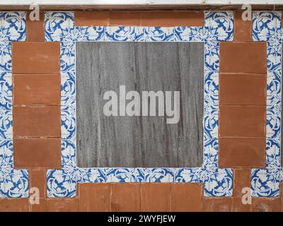 A frame made of traditional blue floral spanish tiles on a marble wall, background texture for text, graphic resource, Cadiz, Andalusia, Spain Stock Photo