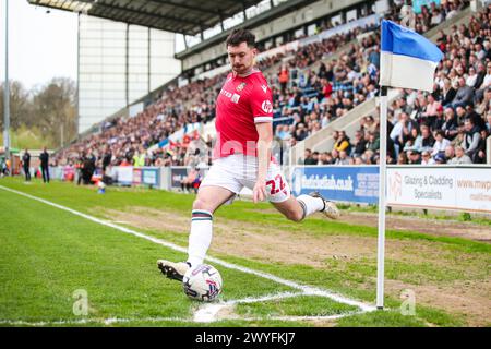 Wrexham's Thomas O'Connor takes a corner during the Sky Bet League Two match at JobServe Community Stadium, Colchester. Picture date: Saturday April 6, 2024. Stock Photo
