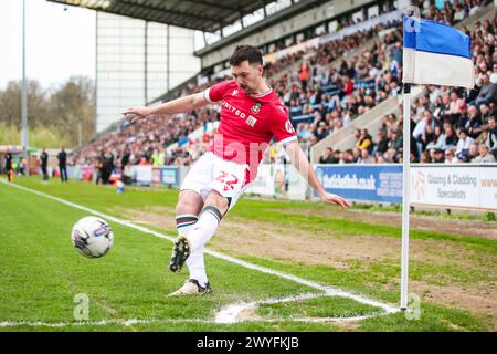 Wrexham's Thomas O'Connor takes a corner during the Sky Bet League Two match at JobServe Community Stadium, Colchester. Picture date: Saturday April 6, 2024. Stock Photo