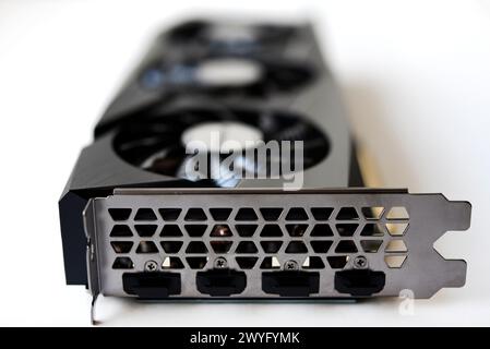 A black and white video card on a white background. Fans and the graphics card case. Computer accessories. Stock Photo