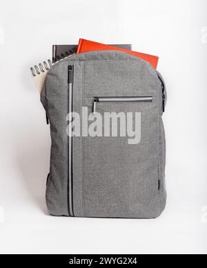 Books, notebooks sticking out from backpack, schoolbag. Stock Photo