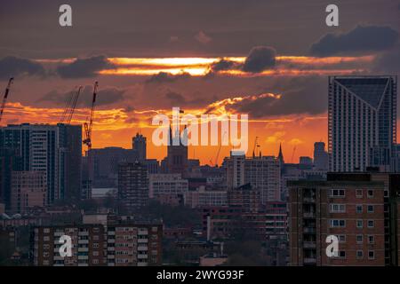 London, UK. 6th April 2024. UK Weather: Storm Kathleen brings a dramatic sunset and evening light over city buildings ending a warm Saturday. Credit: Guy Corbishley/Alamy Live News Stock Photo