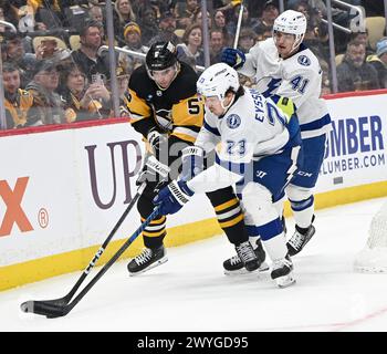 Pittsburgh, United States. 06th Apr, 2024. Pittsburgh Penguins defenseman Ryan Shea (5) and Tampa Bay Lightning center Michael Eyssimont (23) races to the pick during the first period at PPG Paints Arena in Pittsburgh on Saturday, April 6, 2024. Photo by Archie Carpenter/UPI. Credit: UPI/Alamy Live News Stock Photo