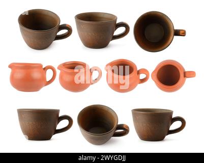 Big set of handmade clay cups isolated on white background. Stock Photo