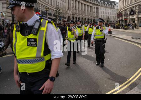 London, UK. 06th Apr, 2024. Metropolitan Police Officers escort demonstrators during the rally. British Congolese held a demonstration in central London to draw attention to the exploitation of the countries natural resources by western technology companies. (Photo by James Willoughby/SOPA Images/Sipa USA) Credit: Sipa USA/Alamy Live News Stock Photo