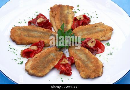 Fried anchovies stuffed with Piquillo peppers. Cuisine School Luis Irizar. Donostia-San Sebastian, Gipuzkoa. Euskadi. Spain. / Anchoas rellenas de Pimiento de Piquillo fritas. Escuela de Cocina Luis Irizar. Donostia, San Sebastián. Euskadi. Stock Photo