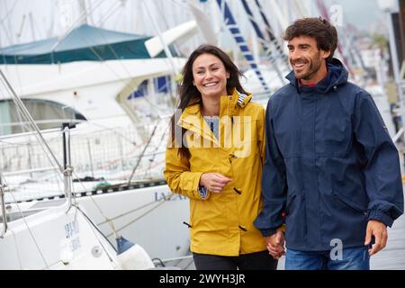 Couple walking. Rain. Marina. Hendaye. Aquitaine. France. Stock Photo