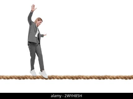 Businesswoman walking rope against white background. Risk or balance concept Stock Photo