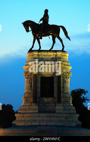 A Statue of Confederate General Robert E Lee that once stood in Richmond Virginia is illuminated at dusk. Stock Photo