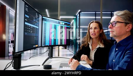 Analyst Employee Working On Spreadsheet Using Desktop Computer Stock Photo