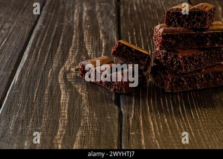 Chocolate bar pieces. Background with chocolate. Sweet food photo concept. Stock Photo