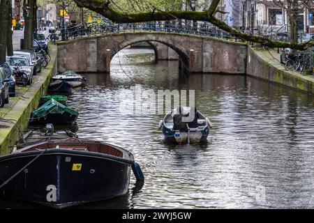 typical bridge crossing Keizersgracht water canal, Amsterdam, Netherlands Stock Photo