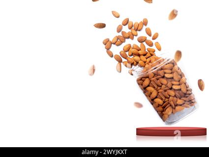 Almonds falling from glass jar isolated on white background with copy space for your text Stock Photo