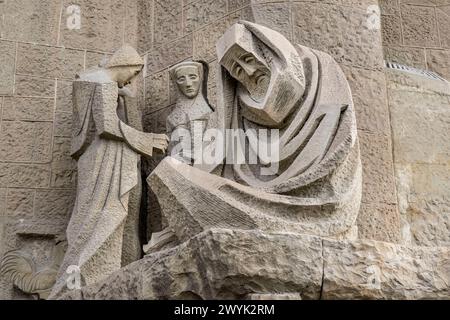 Spain, Catalonia, Barcelona, Eixample district, Sagrada Familia basilica by Catalan modernist architect Antoni Gaudi, listed as a UNESCO World Heritage Site, the passion facade whose sculptures were made by Josep Maria Subirachs, the denial of Saint Peter Stock Photo
