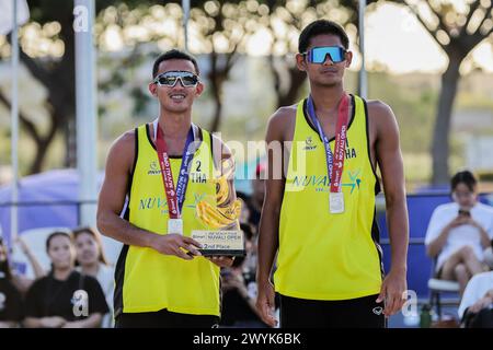 Laguna Province, Philippines. 7th Apr, 2024. Men's silver medalists Pithak Tipjan (R)/Poravid Taovato of Thailand pose for photos during the awarding ceremony of the Asian Volleyball Confederation (AVC) Beach Volleyball Tour Nuvali Open in Laguna Province, the Philippines, on April 7, 2024. Credit: Rouelle Umali/Xinhua/Alamy Live News Stock Photo