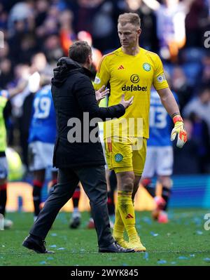 Celtic manager Brendan Rodgers (left) with goalkeeper Joe Hart during the cinch Premiership match at Ibrox Stadium, Glasgow. Picture date: Sunday April 7, 2024. Stock Photo