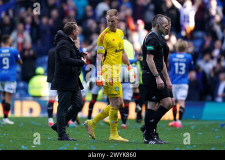 Celtic manager Brendan Rodgers (left) with goalkeeper Joe Hart during the cinch Premiership match at Ibrox Stadium, Glasgow. Picture date: Sunday April 7, 2024. Stock Photo