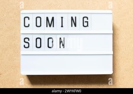 Lightbox with word coming soon on wood background Stock Photo