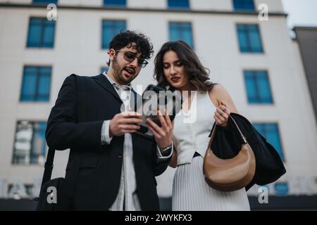 Business colleagues discussing over tablet with cityscape background Stock Photo