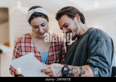 Multicultural team of confident businesspeople brainstorming and analyzing statistics in a corporate office. Stock Photo
