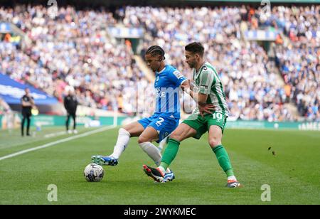 Peterborough United's Jadel Katongo in action against Wycombe Wanderers's Luke Leahy (right) during the Bristol Street Motors Trophy final at Wembley Stadium, London. Picture date: Sunday April 7, 2024. Stock Photo