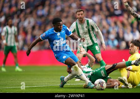 Peterborough United's Kwame Poku attempts a shot on goal during the Bristol Street Motors Trophy final at Wembley Stadium, London. Picture date: Sunday April 7, 2024. Stock Photo