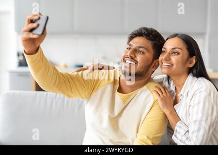 Indian Man Taking Selfie With His Woman Stock Photo