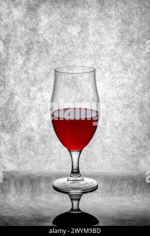 A glass of red wine on a gray background Stock Photo