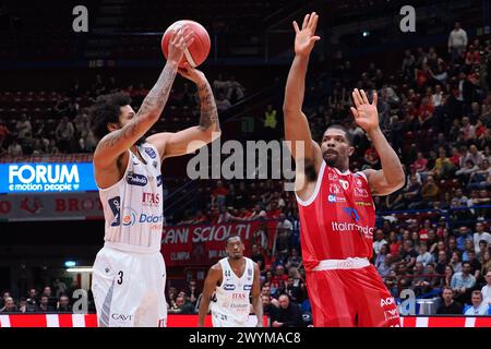 Milan, Italy. 07th Apr, 2024. Prentiss Hubb (Dolomiti Energia Trentino) thwarted by Kyle Hines (EA7 Emporio Armani Olimpia Milano) during EA7 Emporio Armani Milano vs Dolomiti Energia Trentino, Italian Basketball Serie A match in Milan, Italy, April 07 2024 Credit: Independent Photo Agency/Alamy Live News Stock Photo