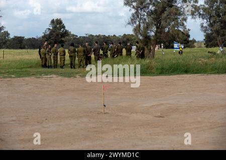 A group of Israeli soldiers stand next to a memorial site in a field. On October 7th, 2023 the Palestinian Islamist militant group Hamas led a surprise attack on Israel, killing an estimated 1200 Israelis and taking more than 200 hostages. An estimated 360 young men and woman who attended the Nova music festival were killed during the attacks. The site of the festival has now become a memorial site to those who were killed and taken as hostages. (Photo by Syndi Pilar/SOPA Images/Sipa USA) Credit: Sipa USA/Alamy Live News Stock Photo