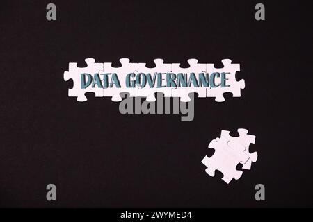 A jigsaw puzzle with the words Data Governance written on it Stock Photo