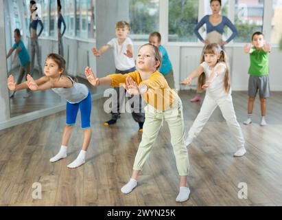 Group of children warming up before dance class Stock Photo